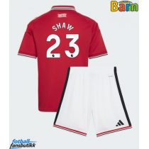 Manchester United Luke Shaw #23 Hjemmedraktsett Barn 2026-27 Kortermet (+ Korte bukser)